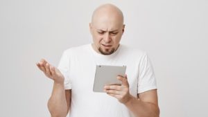 Person Thinking How to Add a VPN in iPad